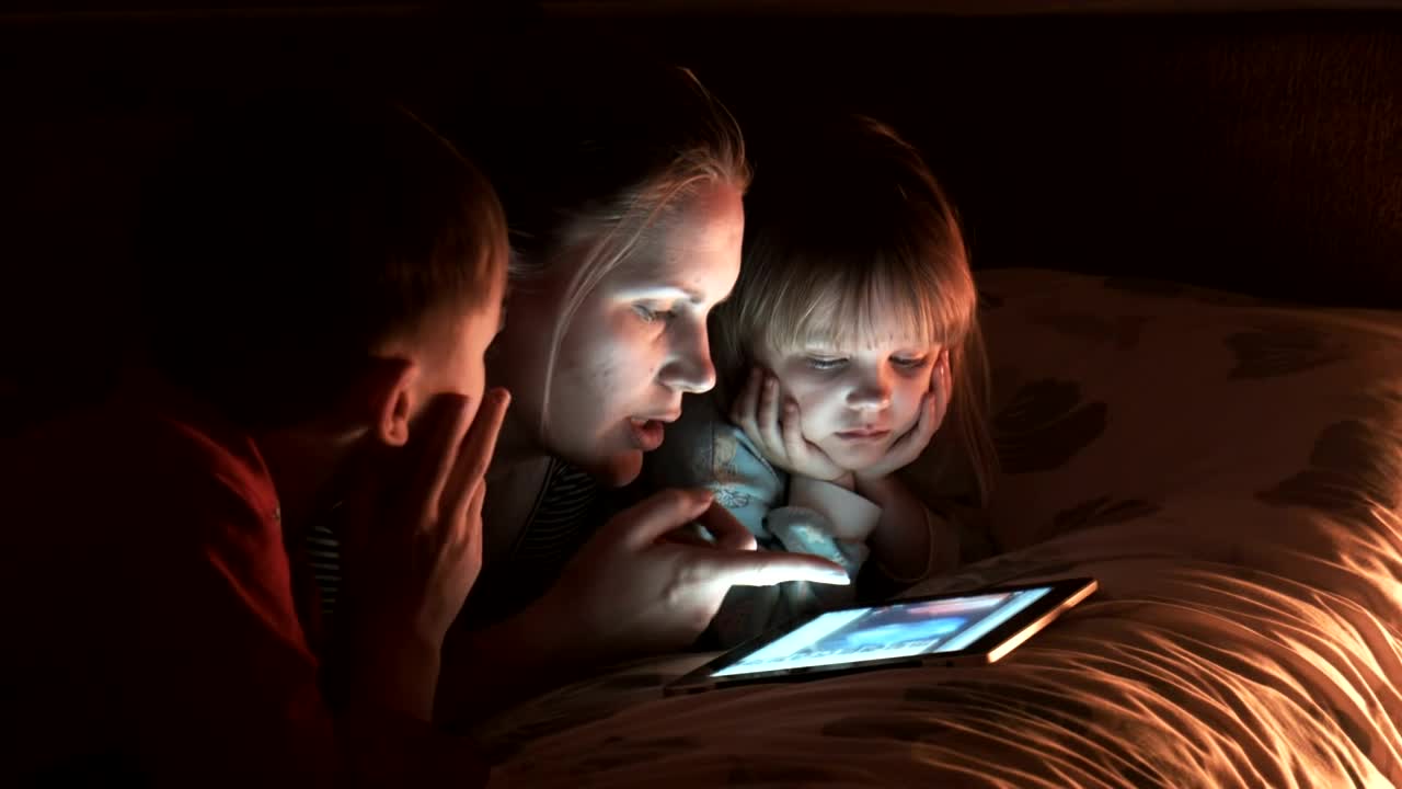 Download Stock Video Mother With Two Children Watching The Tablet Live Wallpaper