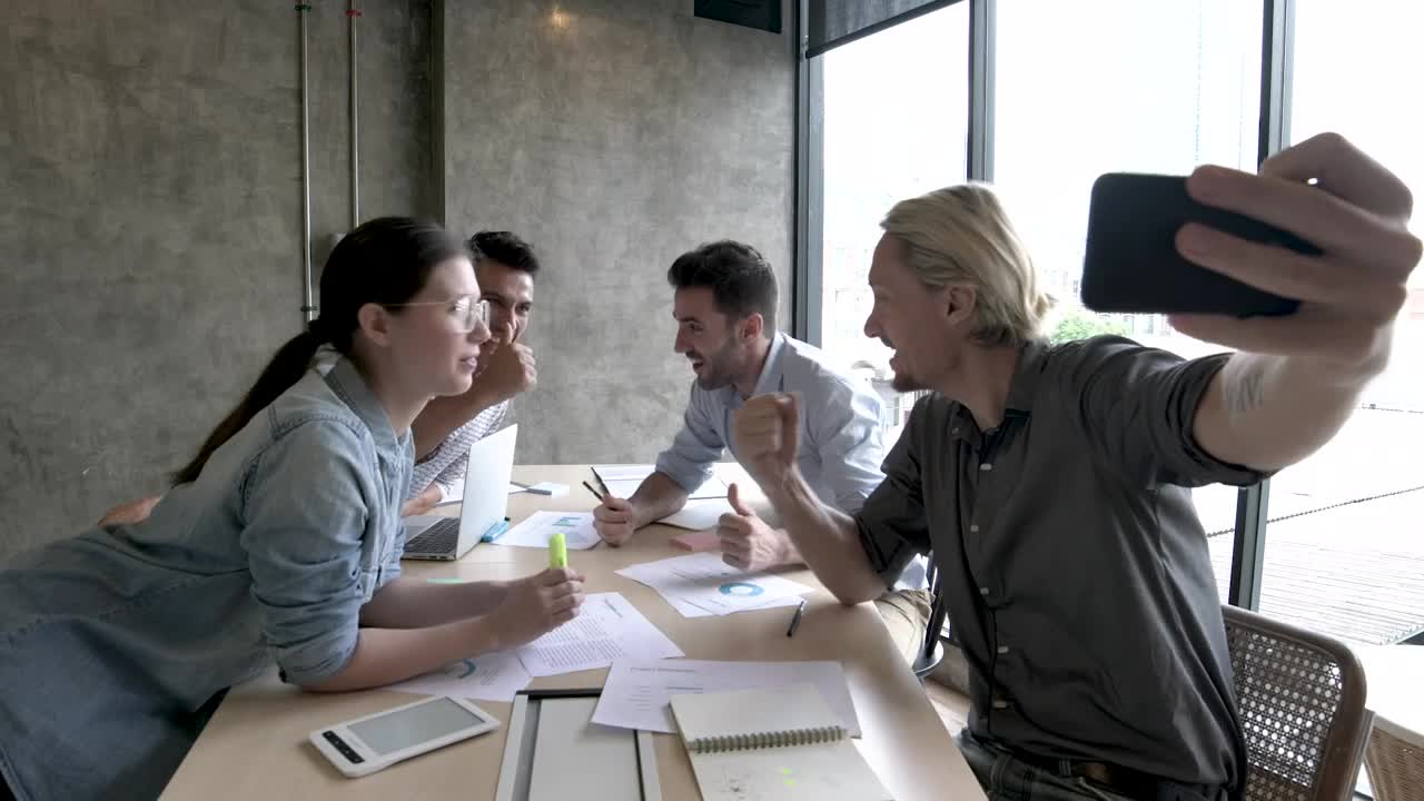 Download Stock Video Motivated Work Team Taking A Selfie Live Wallpaper