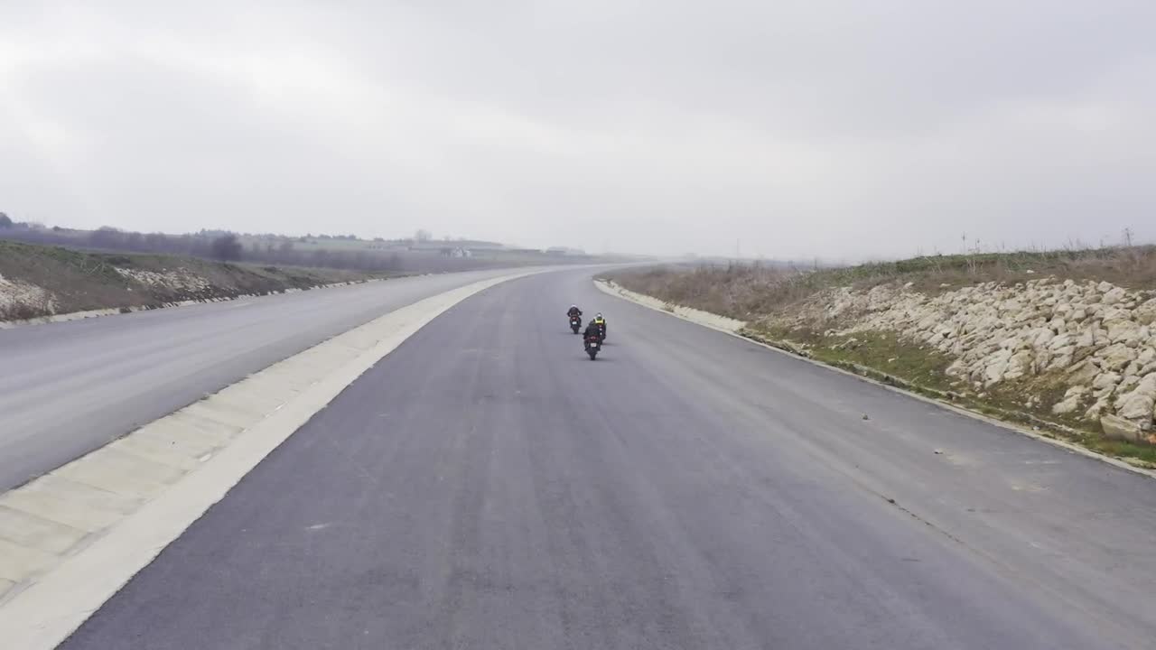 Download Stock Video Motorcycles Racing Down A Road Live Wallpaper