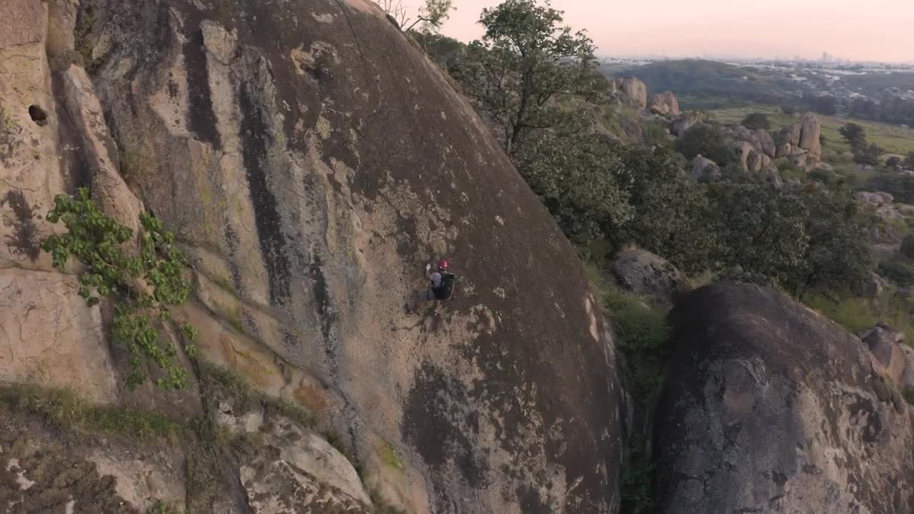 Download Stock Video Mountaineer Going Down A Mountain Live Wallpaper