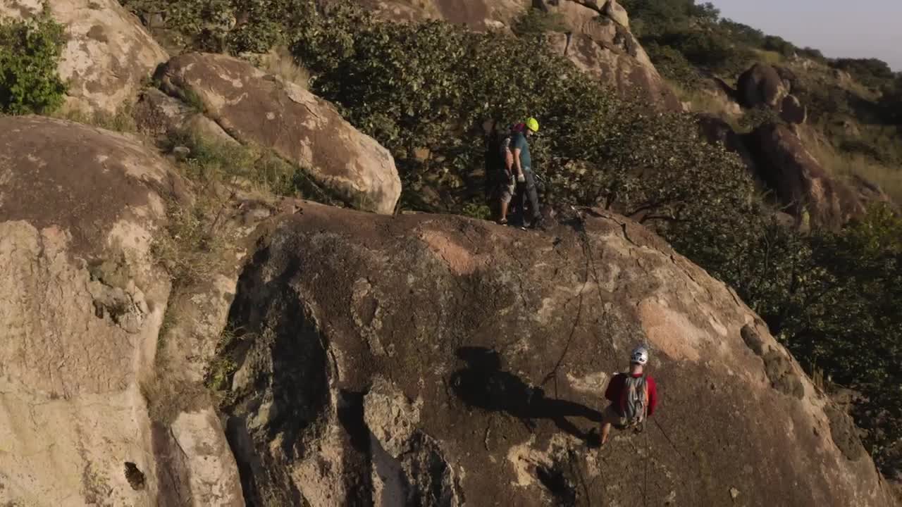 Download Stock Video Mountaineers Descending A Mountain Viewed From Above Live Wallpaper