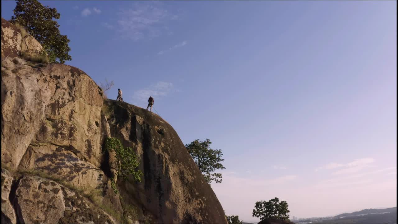 Download Stock Video Mountaineers On Top Of A Mountain Seen From The Air Live Wallpaper