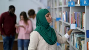 Stock Video Muslim Student Browsing A Library Live Wallpaper
