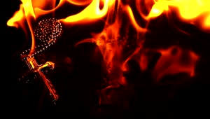 Stock Video Necklace Of A Burning Crucifix Close Up Live Wallpaper