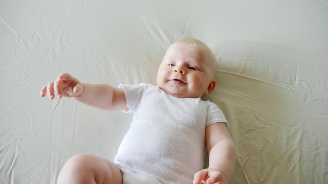 Download Stock Video New Baby Boy Laughing On Bed Live Wallpaper