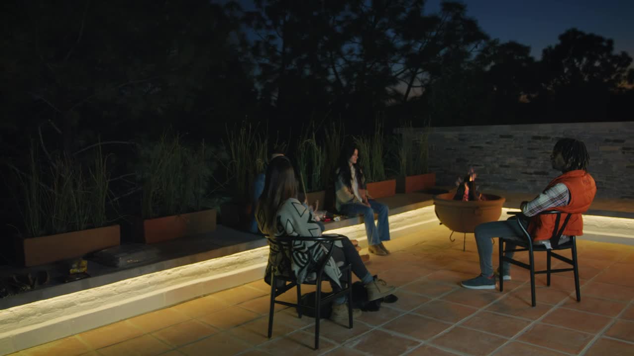 Download Stock Video Night With Friends Around A Campfire Live Wallpaper