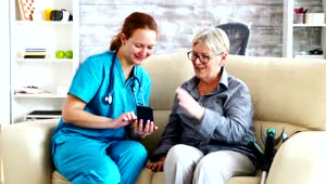 Stock Video Nurse Sitting With A Patient Live Wallpaper