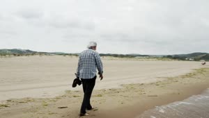 Stock Video Old Man Walking By The Shore Live Wallpaper