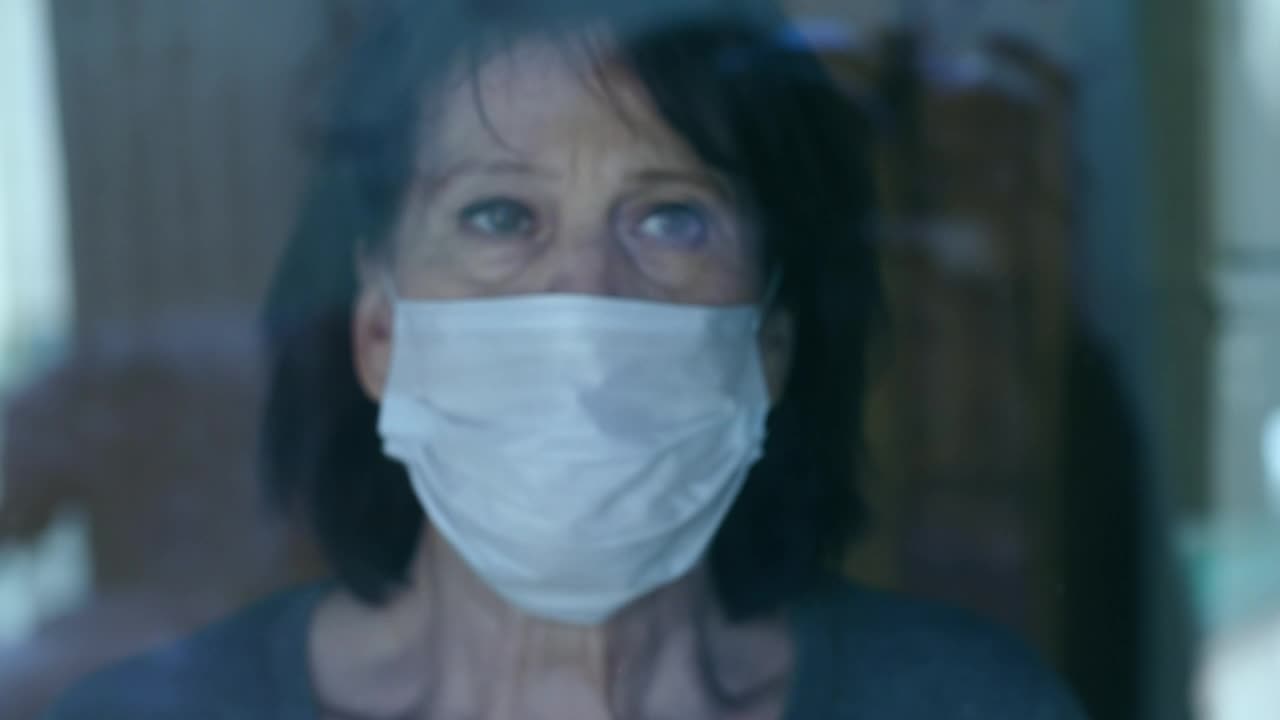 Download Stock Video Old Woman Looks With Concern Out The Window Live Wallpaper