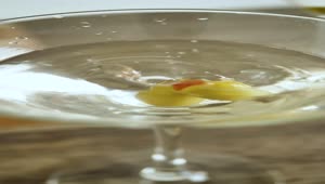 Stock Video Olive Falling Into A Martini Glass Live Wallpaper
