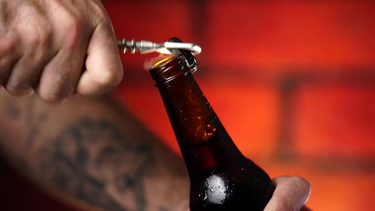 Download Stock Video Opening A Beer Bottle Close Up View Live Wallpaper