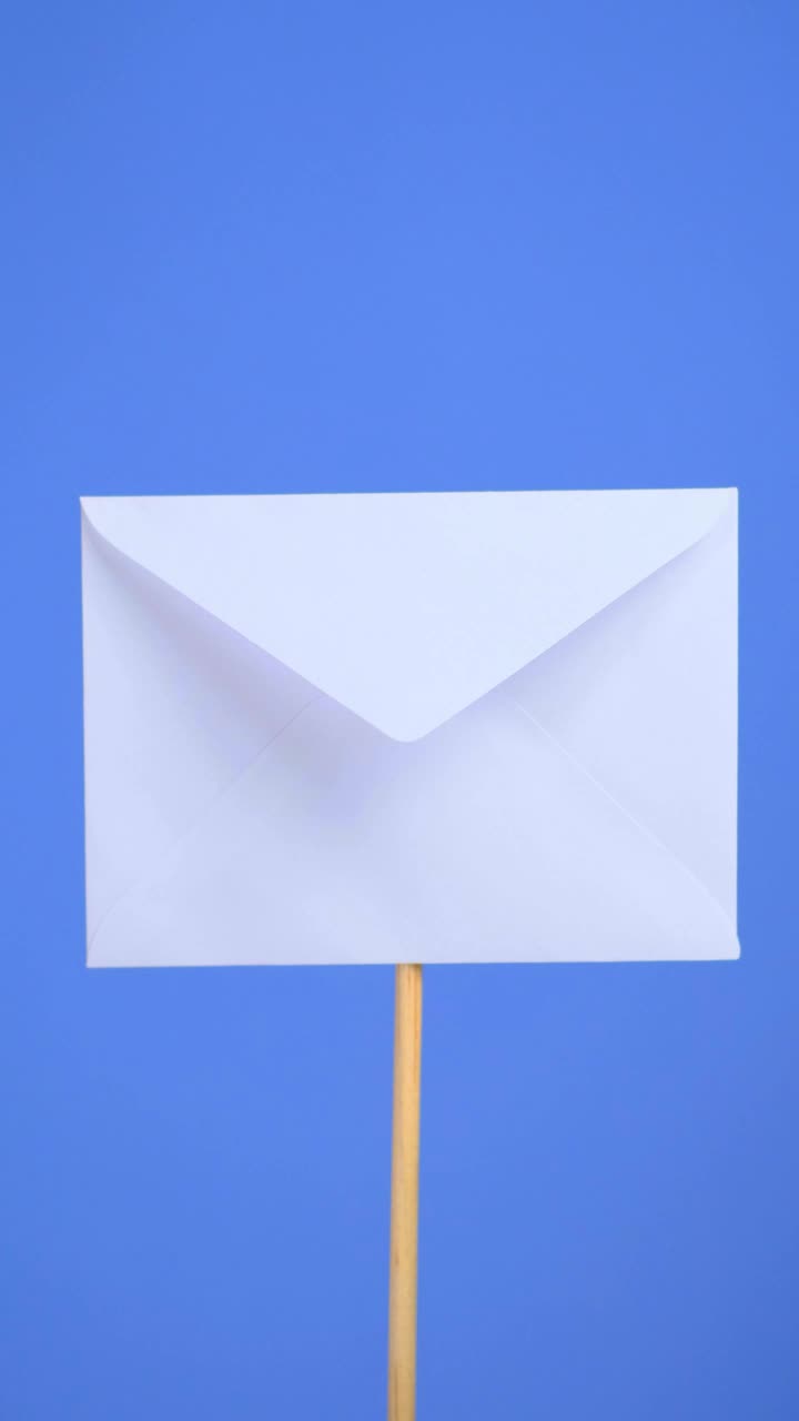 Download Stock Video Opening A White Envelope On A Blue Background Live Wallpaper