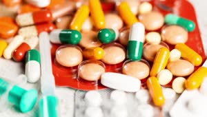 Stock Video Orange And Green Pills On Pharmacy Counter Live Wallpaper