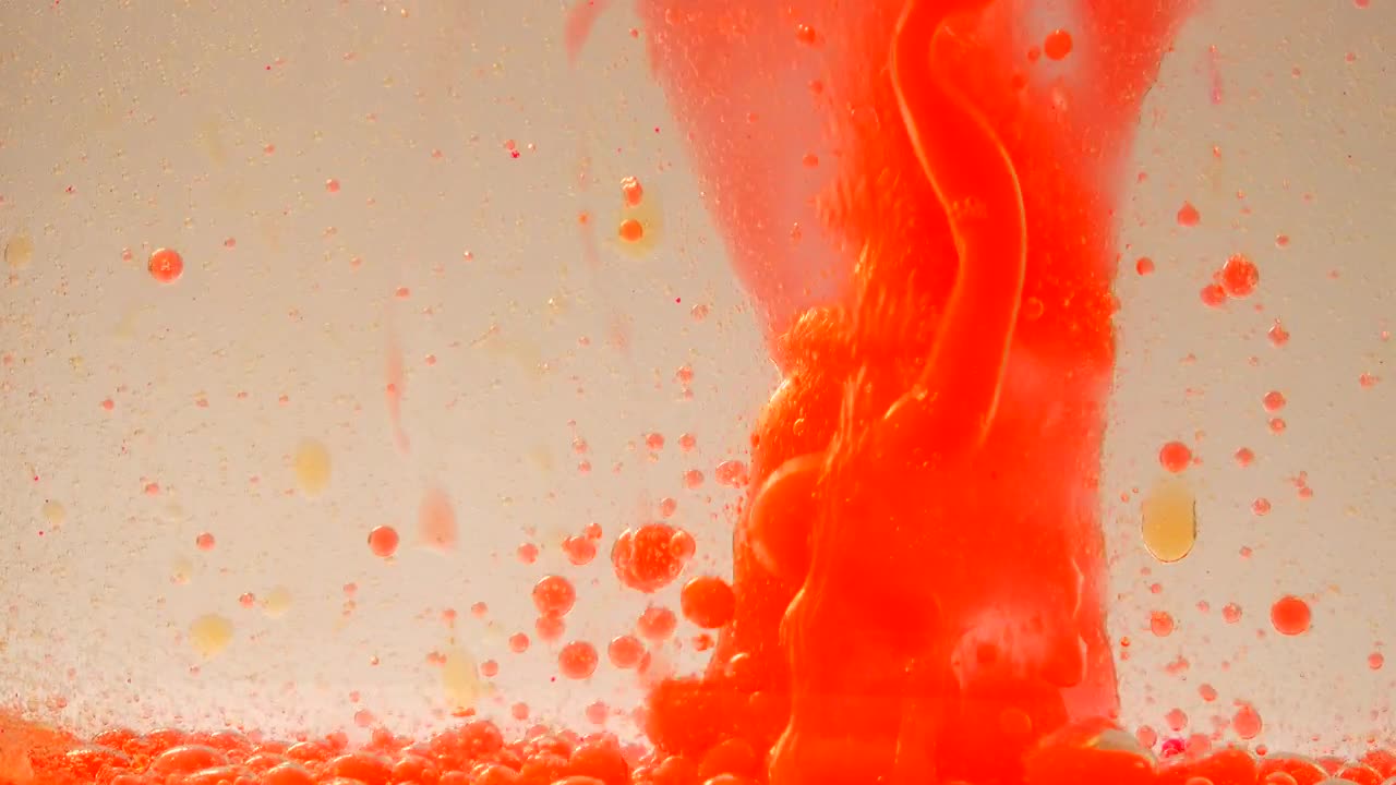 Download Stock Video Orange Ink Bubbles In A Water Tank Live Wallpaper