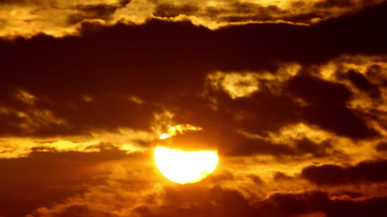 Download Stock Video Orange Sunrise Against Black Clouds Live Wallpaper