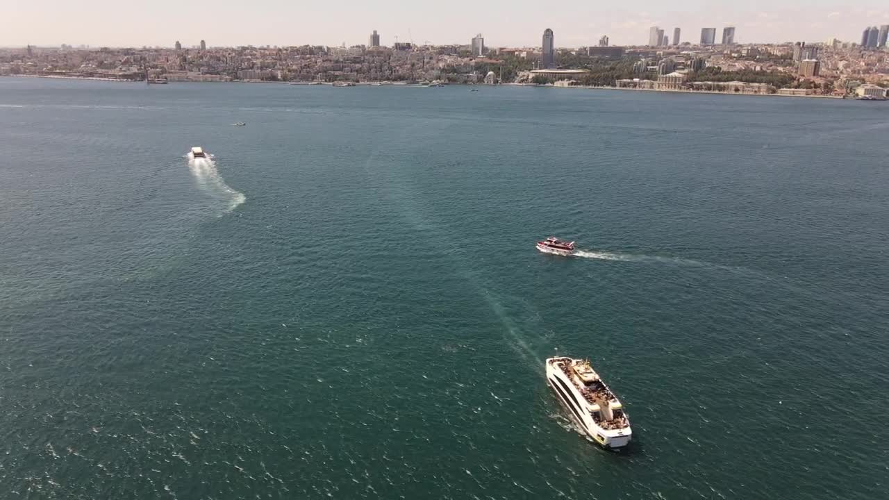 Download Stock Video Over The Sea With Boats Near A Sunny Coast Live Wallpaper