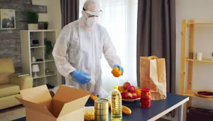 Stock Video Packing Groceries In Ppe For Coronavirus Safety Live Wallpaper