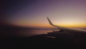 Stock Video Panorama From The Window Of An Airplane At Dusk Live Wallpaper