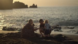 Stock Video Parents With Two Young Children At The Beach Live Wallpaper