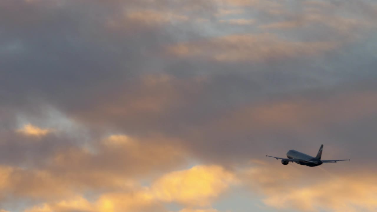 Download Stock Video Passenger Plane Flying Towards Clouds Live Wallpaper
