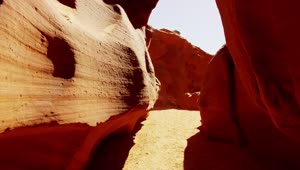 Stock Video Passing Between Rock Formations In The Desert Live Wallpaper