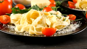 Stock Video Pasta Dish With Tomato On Black Plates Live Wallpaper