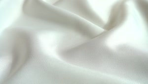 Stock Video Pearls Falling On White Silk Live Wallpaper