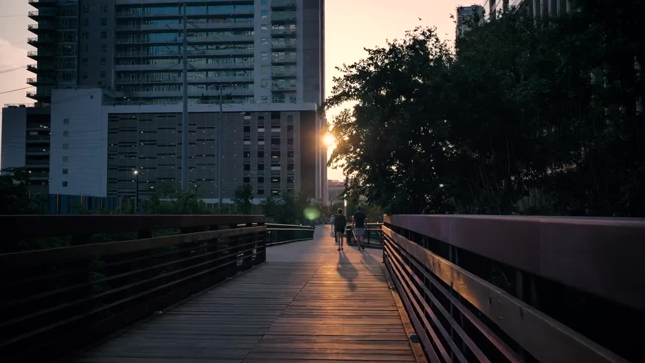 Download Stock Video Pedestrian Bridge In A City During Sunset Live Wallpaper