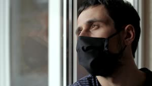 Stock Video Pensive Man In Quarantine Wearing Face Mask Live Wallpaper