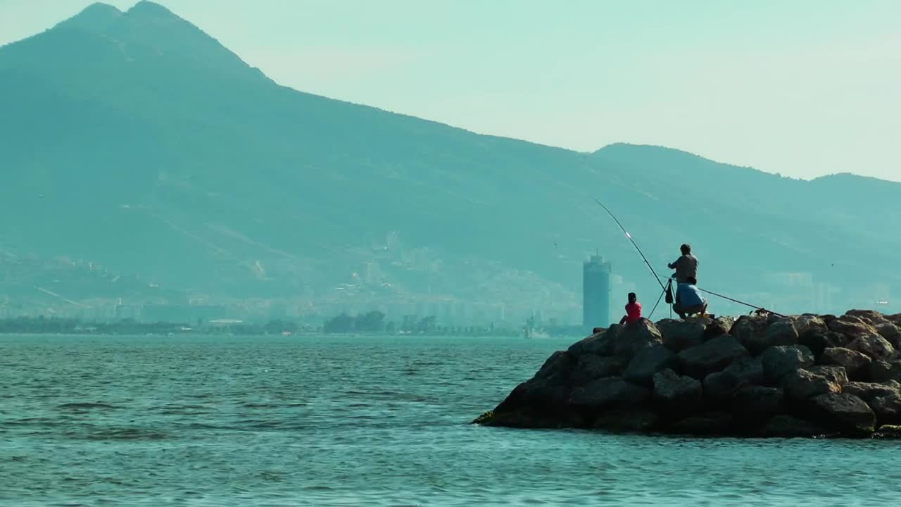 Download Stock Video People Fishing At The Seashore Live Wallpaper