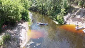 Stock Video People Kayaking Along A River Aerial Shot Live Wallpaper