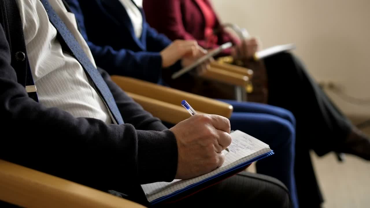 Download Stock Video People Taking Notes During A Meeting Live Wallpaper