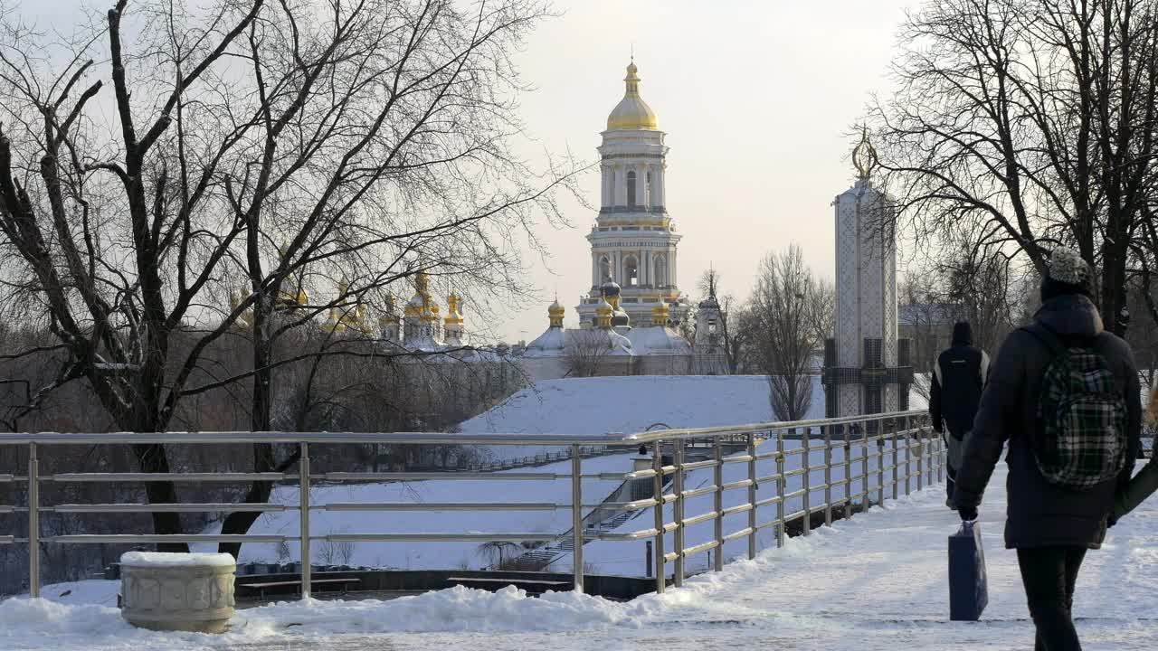 Download Stock Video People Walking On A Snowy Bridge Live Wallpaper