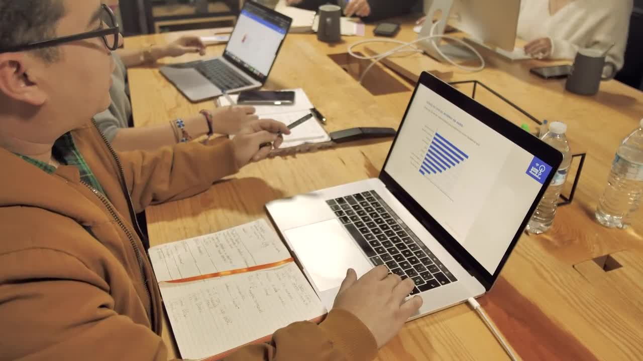 Download Stock Video People Working On A Wooden Table Live Wallpaper