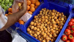Download Stock Video Person Choosing Fruit In A Market Live Wallpaper