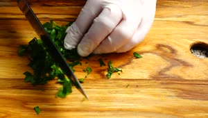Download Stock Video Person In Gloves Cutting Parsley Live Wallpaper