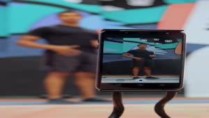 Stock Video Person Is Filmed Exercising With A Cell Phone Live Wallpaper