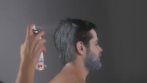 Stock Video Person Painting The Hair Of A Winter Model Live Wallpaper
