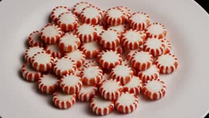 Video Stock Red Spermints On A White Plate Rotating Live Wallpaper Free