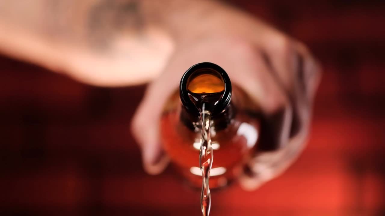 Download Video Stock Person Pouring Beer From A Glass Bottle Live Wallpaper Free