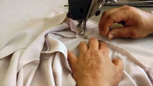Download Video Stock Person Sewing A Shirt On Machine Live Wallpaper Free