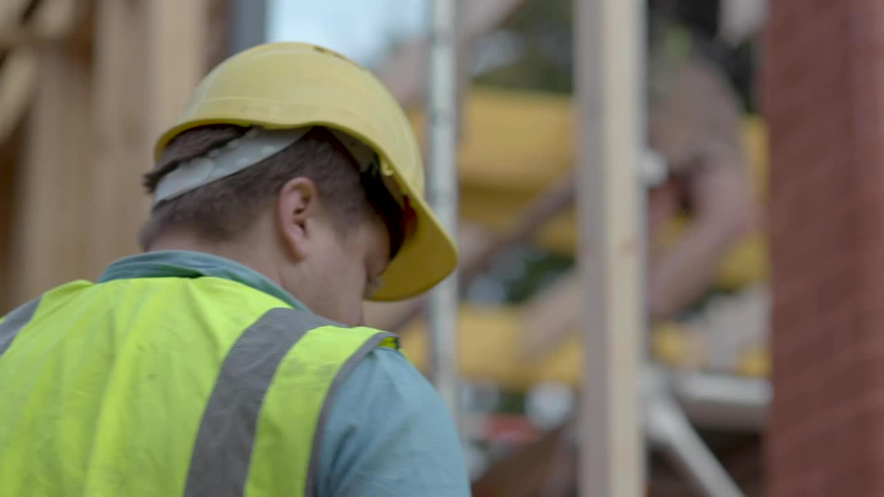 Download Video Stock Person Takes A Phone Call At A Construction Site Live Wallpaper Free