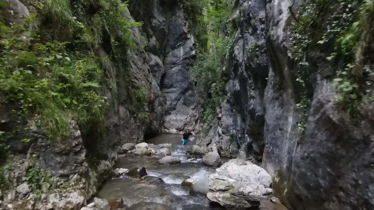 Download Video Stock Person Walking By A River In The Mountains Live Wallpaper Free