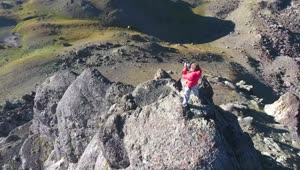 Video Stock Photografer In The Top Of A Rock In The Mountains Live Wallpaper Free