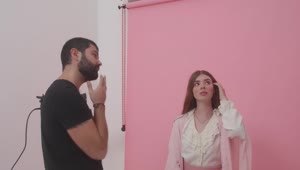 Video Stock Photographer Directing A Model During A Photoshoot Live Wallpaper Free