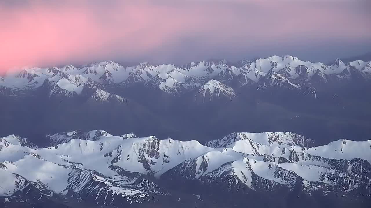 Download Video Stock Pink Clouds Over A Snowy Mountain Range Live Wallpaper Free