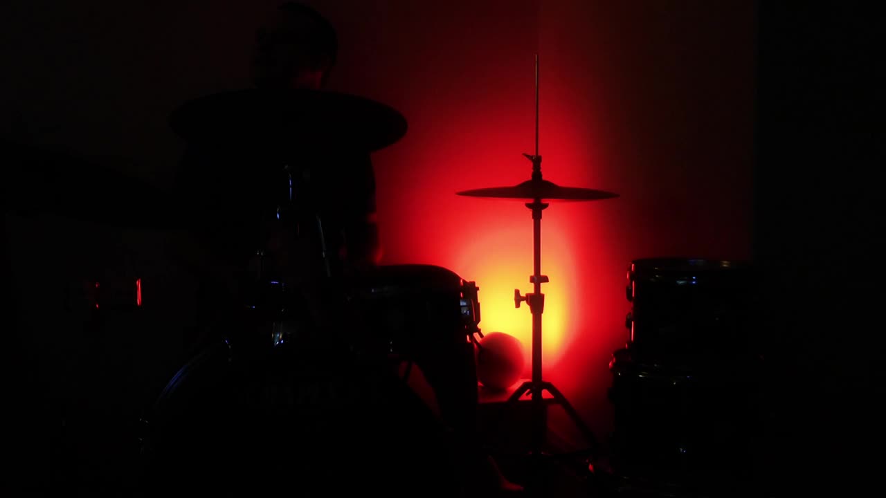 Download Video Stock Playing Drums In The Dark Under Colored Light Live Wallpaper Free