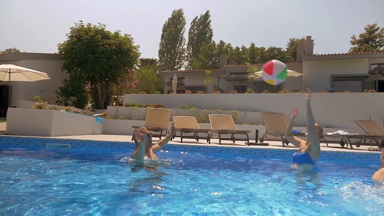 Download Video Stock Playing With A Large Ball In The Pool  LargeLive Wallpaper Free