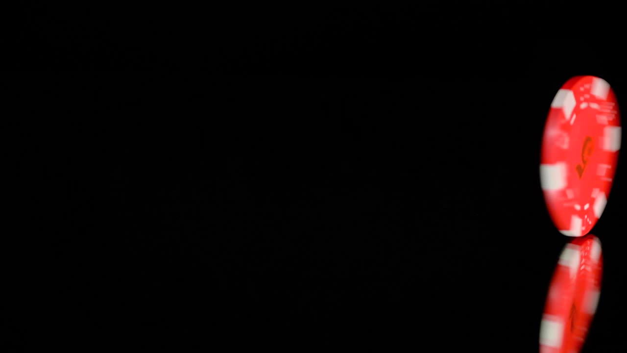 Download Video Stock Poker Chip Spinning On A Black Background Live Wallpaper Free