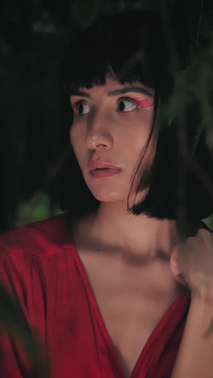 Download Video Stock Portrait Of A Girl In Red Dress Through The Branches Live Wallpaper Free